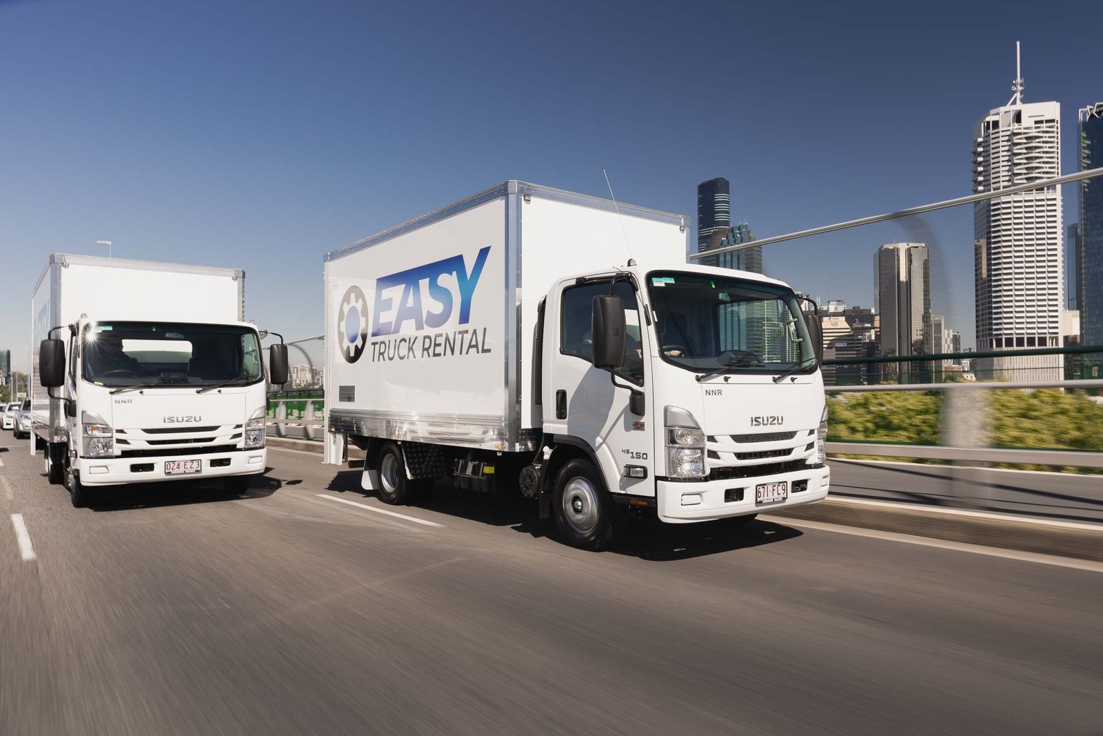 Easy Truck Rental trucks crossing a Brisbane bridge